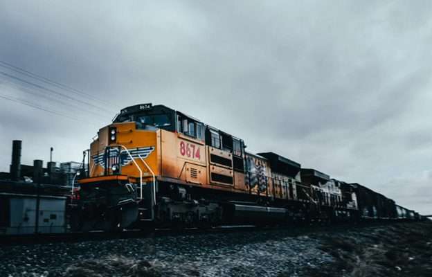 Heavy diesel freight locomotive hauling cargo train, representing rail transport operations facing emissions reduction challenges. - i would change the image as this is a US style locomotive. I can share images of Colas Rail Class 66 diesel locos & seek their permission to use.